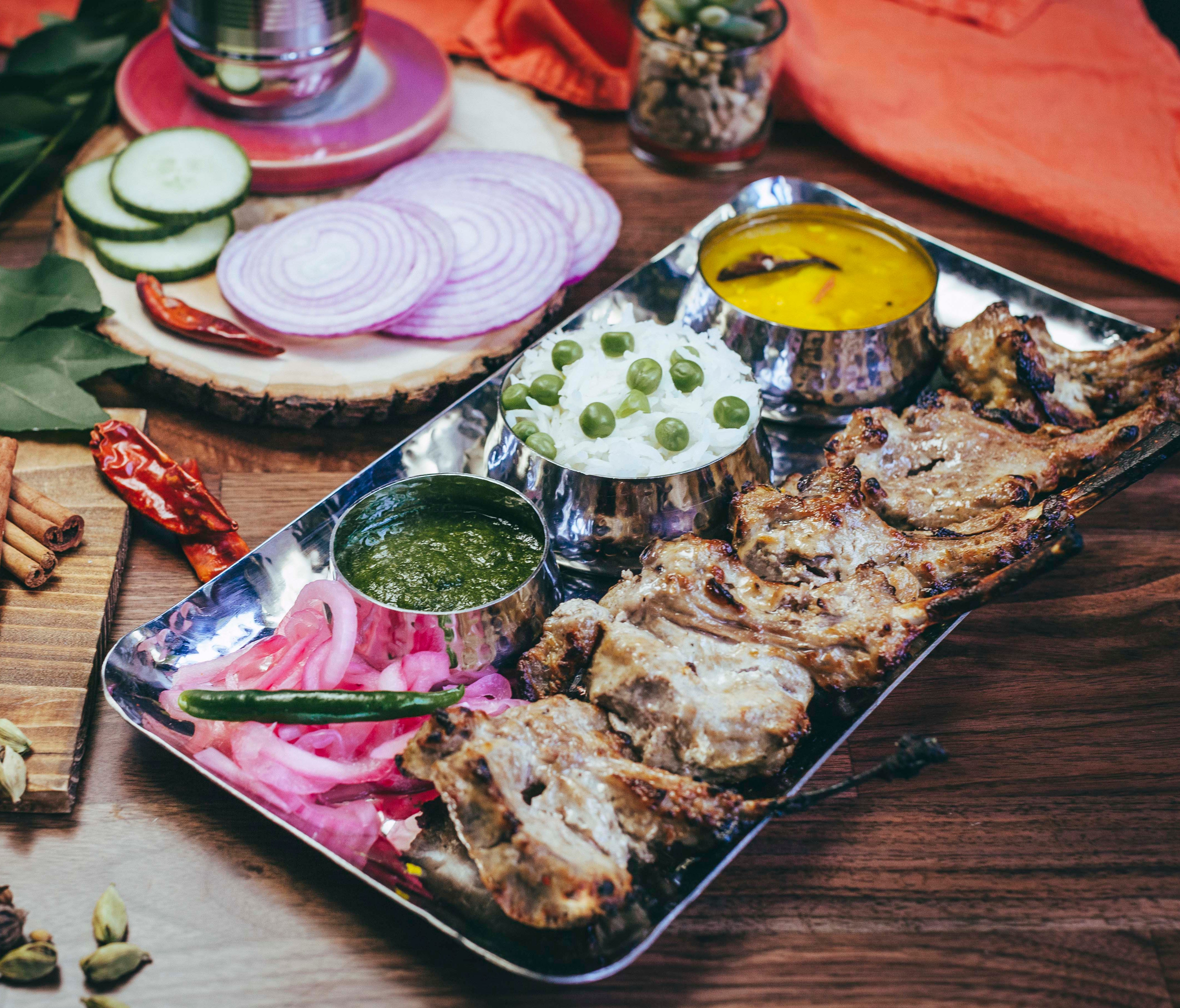 Executive chef Navjot Arora serves Indian soul food such as these tandoor-grilled rum lamb chops.