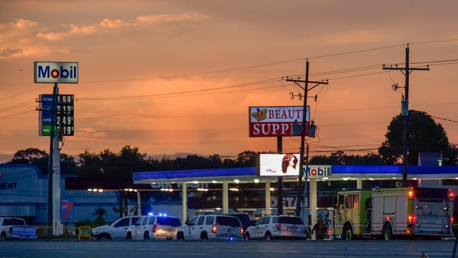 On July 17, Baton Rouge, La., police investigate the scene where several law enforcement officers were killed and wounded. Attacks on police in Texas and Louisiana by former military men have touched a nerve among veterans, who traditionally share a close bond with law enforcement.