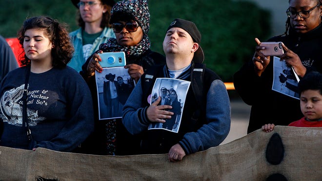 Community members attend a Tuesday vigil outside El Mercadito de Memphis in Hickory Hill to support Manuel Duran. The reporter for a Spanish-language media outlet was arrested April 3 while doing a live Internet video of a Memphis protest. Duran has since been transferred to an immigration detention center in Louisiana.