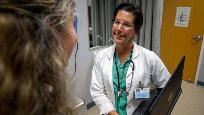 Kathleen Callaghan, MD, talks to a potential patient at Memorial Medical Center’s Cima Women’s Healthcare in a 2016 file photo.