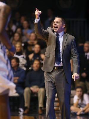 Butler coach Chris Holtmann shouts instructions to his team during the first  half of a 73-52 win over Marquette at Hinkle Fieldhouse on Feb. 25, 2015.