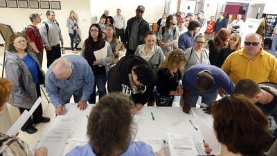 In this April 2014 file photo, job seekers line up for a job fair at Columbia-Greene Community College in Hudson, N.Y. A far more durable U.S. economy has emerged from the wreckage of the Great Recession. And_tragically_ that has been a problem for the now five-year recovery.