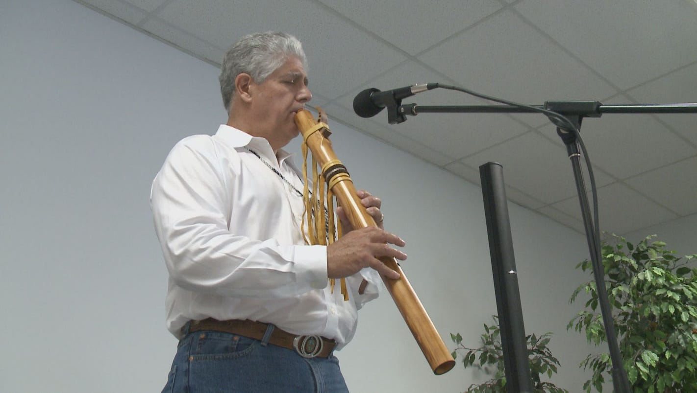 Native American Flute player shares talent with kids