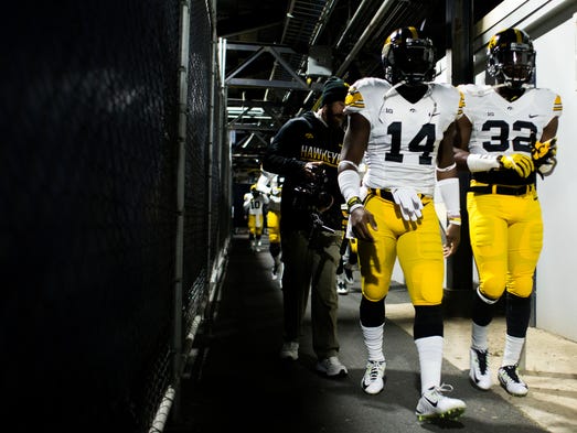 Iowa Defensive Back Desmond King (14) and Iowa Running