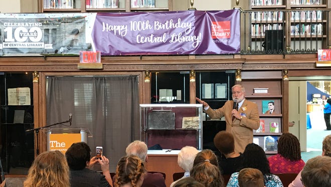 Michael Williams, manager of the Central Library, unveils the libary's 1917 capsule.