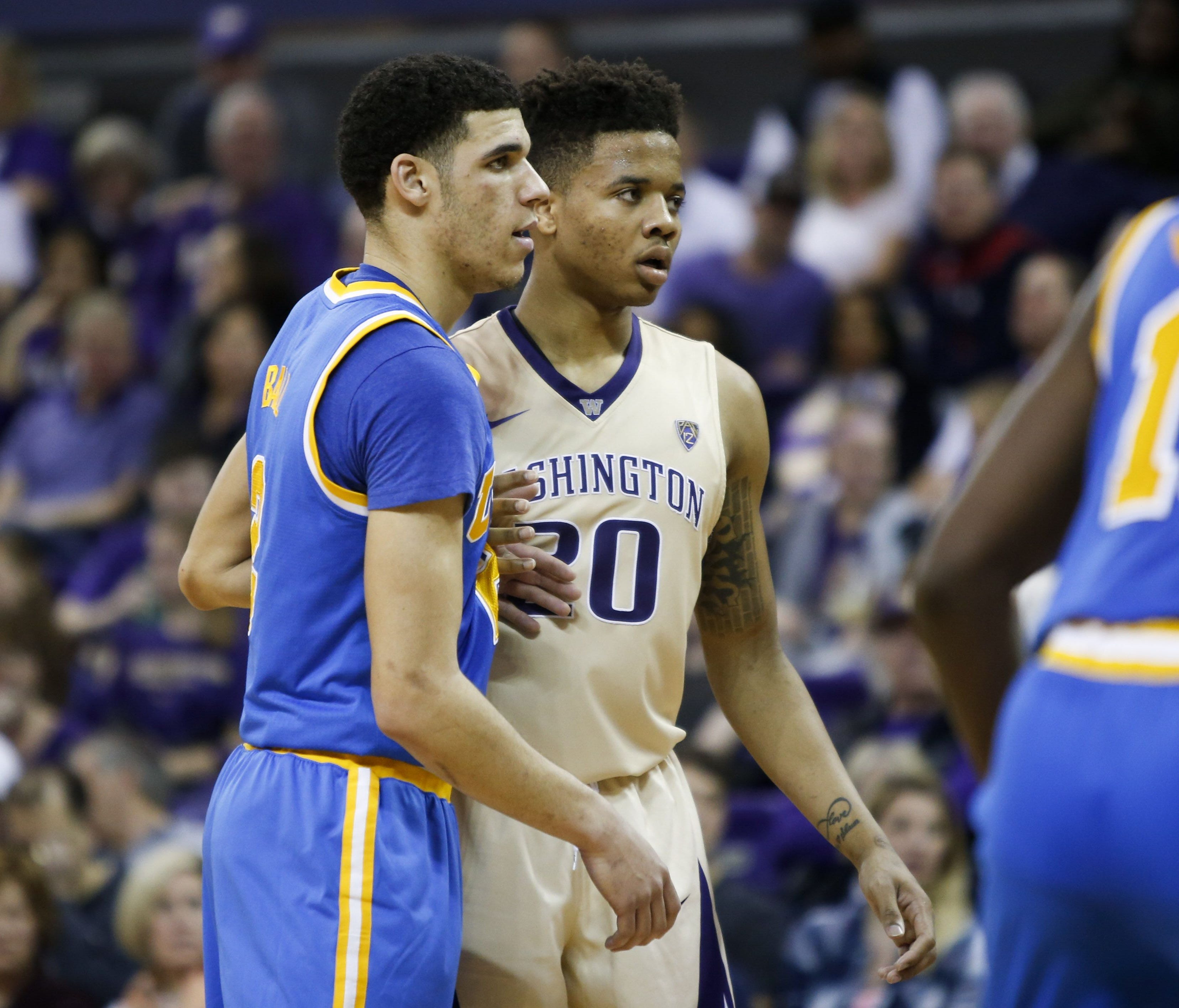 Lonzo Ball and Markelle Fultz guard each other during a game at Alaska Airlines Arena.