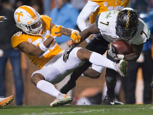 Vanderbilt running back Ralph Webb (7) falls into the