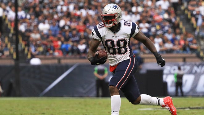 Martellus Bennett of the New England Patriots runs with the ball after a reception against the Oakland Raiders during the second half at Estadio Azteca on November 19, 2017 in Mexico City, Mexico.