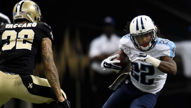 Titans running back Dexter McCluster (22) races past Saints strong safety Kenny Vaccaro (32) during the second quarter.