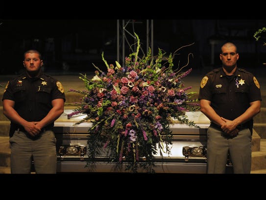 Deputies watch over casket of fallen officer's daughter