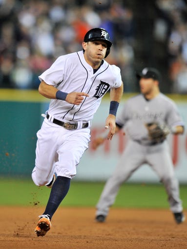 Tigers' Ian Kinsler heads for third and tries to score on a ground rule double by Torii Hunter but is sent back to third base in the seventh inning. The Tigers scored twice to take a 3-0 but later gave up the lead.