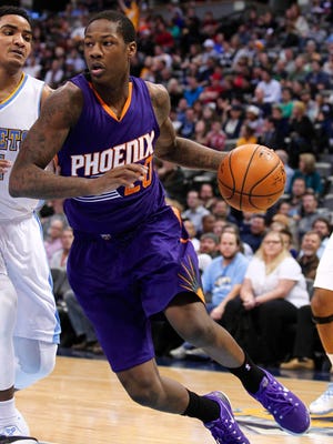Nov 28, 2014; Denver; Phoenix Suns guard Archie Goodwin (20) controls the ball in the fourth quarter against the Denver Nuggets at Pepsi Center.