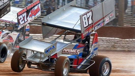 Three cars battle for the early lead at Lincoln Speedway in a 410 Sprint race Sunday - eventual winner Brian Montieth (21), Greg Hodnett (27) and Alan Krimes (87).