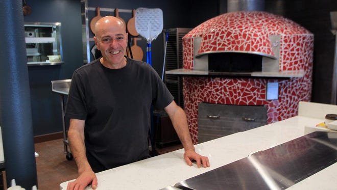 Aziz Longou had the 5,000-pound oven at his Red Vespa restaurant shipped from Naples.