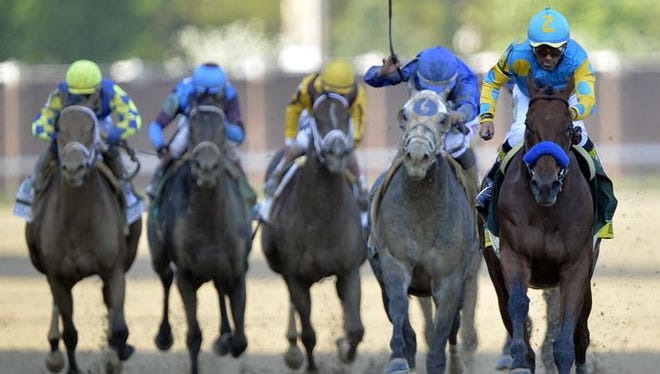 The Kentucky Derby drew record attendance and plenty of wagering Saturday.