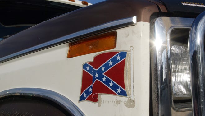 A truck with a Confederate flag decal.