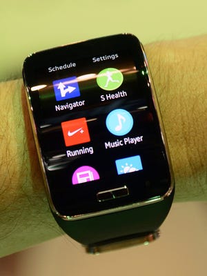 A Samsung Gear S wearable monitor and watch with a Qualcomm Snapdragon 400 processor is displayed at the 2015 International Consumer Electronics Show (CES) in Las Vegas.