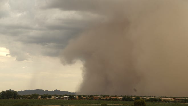 A dust storm comes through Gilbert on July 14, 2018.