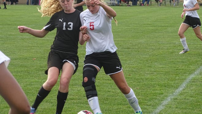 Olivia Ward battles for the ball in Coshocton's sectional final game Thursday.