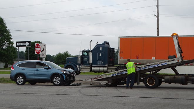 A woman passenger in a Honda CVR suffered minor injuries in a two-vehicle crash Monday afternoon. Both cars were towed from the scene.