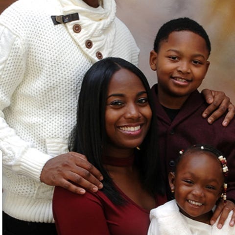 Issa Sao, with his wife, Eboni, and their two...
