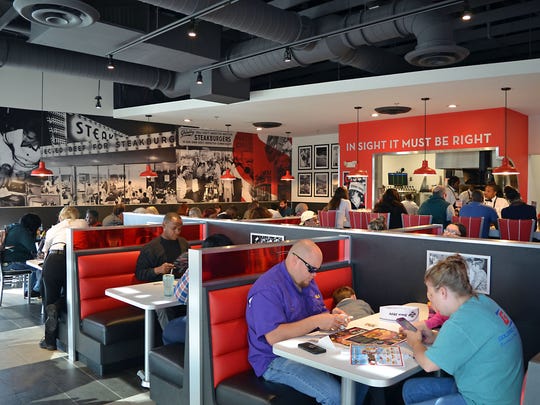 Steak 'n Shake customers enjoy their meal and the restaurant
