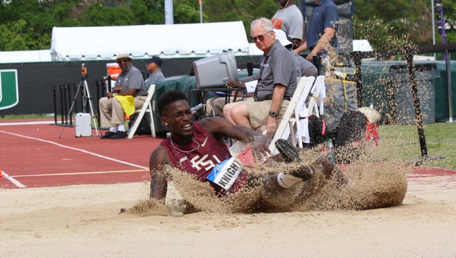 FSU's Corion Knight lands after pulling out his winning leap in the long jump at the ACC Outdoor Track & Field Championships.