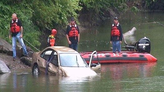 Authorities pull a car from the Chemung River on Wednesday morning near the boat launch at the Ashland Toll Bridge Park.