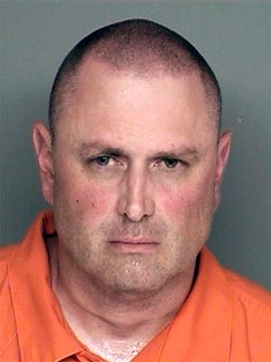 FILE - This undated booking photo provided by the Santa Barbara County Sheriff's Office shows Nicolas Holzer. Santa Barbara County prosecutors announced Tuesday Oct. 14, 2014 that a grand jury indicted 45-year-old Nicolas Holzer on felony charges that include special allegations. Prosecutors haven’t decided whether to seek the death penalty. Holzer remains jailed without bail.  (AP Photo/Santa Barbara County Sheriff's Office)