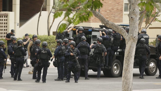 Police officers respond to the scene of a fatal shooting at the University of California, Los Angeles, on Wednesday.