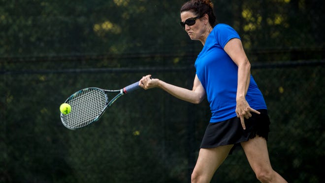 Catherine Leon, of Port Huron, returns the ball during practice for the Francis J. Robinson Memorial Tennis Tournament Tuesday, August 2, 2016 at Sanborn Park in Port Huron.