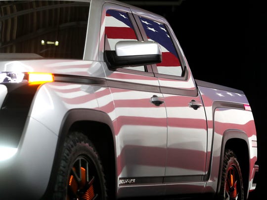 The US flag reflects on  Lordstown Motors' new electric pickup Endurance, on Thursday, June 25, 2020, Lordstown, Ohio.
