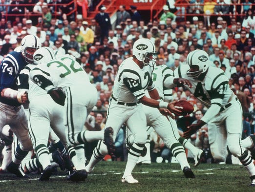 Super Bowl III (Jets 16, Colts 7): Quarterback Joe Namath of the New York Jets hands off the football to Matt Snell during Super Bowl III on Jan. 12, 1969. Namath came through on his famous "guarantee" of a Jets upset against the heavily favored Colts.