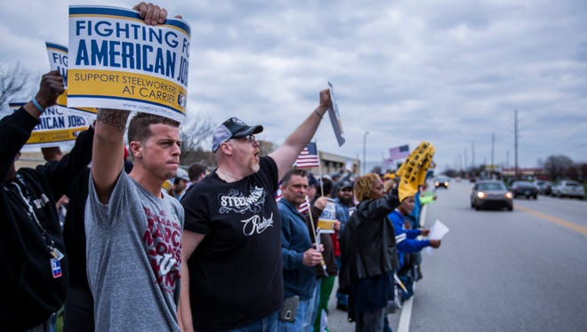 Hundreds line the roadway in front of the Carrier Corp. plant on the city's west side to protest the company's decision to move its facility to Mexico.