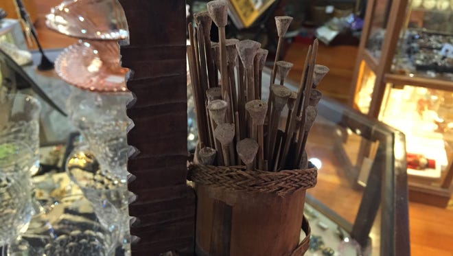 This quiver of blowgun darts is among the inventory at Art & Antiques Plus in downtown Salem. The darts reportedly came home from the Philippines after World War II.