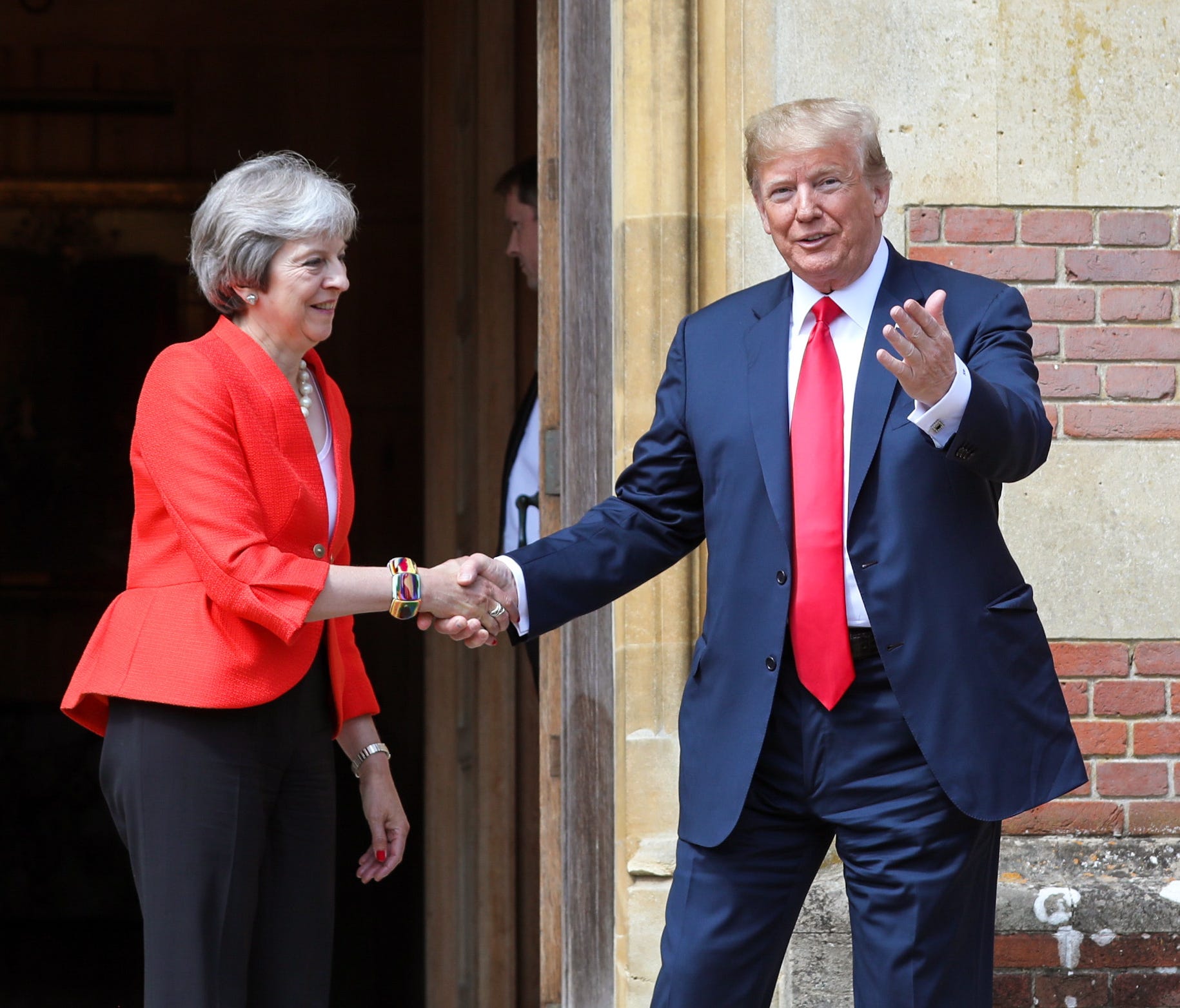 British Prime Minister Theresa May shakes hands with President Donald Trump as he arrives for their bilateral meeting at Chequers, England,