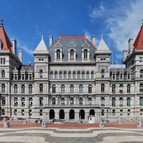 New York State Capitol, Albany, 1899 (Architect: Thomas Fuller, FAIA, Leopold Eidlitz, FAIA, Henry Hobson Richardson, FAIA, Isaac G. Perry): Started in 1867 and completed in 1899, at a cost of $25 million (equivalent to $720 million in 2016), it was the most expensive government building of its time. The design encompassed various styles because of the replacement of architects during construction. The ground floor of the state capitol was built in the Classical/Romanesque style, when Lieutenant Governor William Dorsheimer dismissed Fuller in favor of Eidlitz and Richardson, who built the next two floors in a Renaissance Classical style, noticeable on the exterior two floors as light, open columnwork. The increasing construction costs became an ongoing source of conflict in the legislature, and it was difficult to secure the funding necessary. Eidlitz and Richardson were dismissed by Grover Cleveland upon his election to governorship. He then hired Perry to complete the project. The legislative chambers, the fourth floor and roof work were all finished in Victorian-modified Romanesque that was distinctively Richardson's design, the dominate the final outcome of the grand building, which evolved into his distinguished Romanesque style. It was listed on the National Register of Historic Places in 1971, then included as a contributing property when the Lafayette Park Historic District was listed in 1978. The New York State Capitol was declared a National Historic Landmark in 1979.