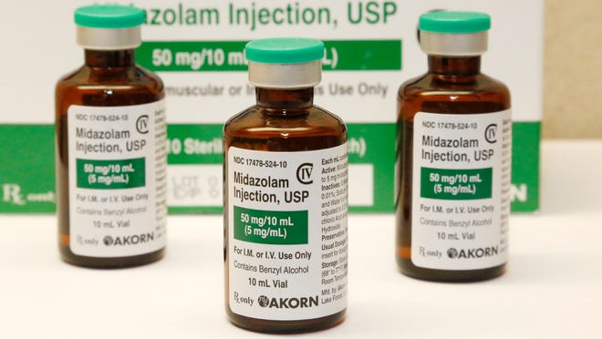 FILE - This July 25, 2014 photo shows bottles of the sedative midazolam at a hospital pharmacy in Oklahoma City. Oklahoma is one of three states where executions have gone awry this year using midazolam as part of a two- or three-drug lethal injection process. Officials in Texas and Missouri, two of the most active death penalty places, are confident in the use of their single drug pentobarbital and show no willingness to slow down. (AP Photo/File)