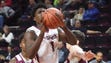 Don Bosco #1 Marcellus Earlington has control during