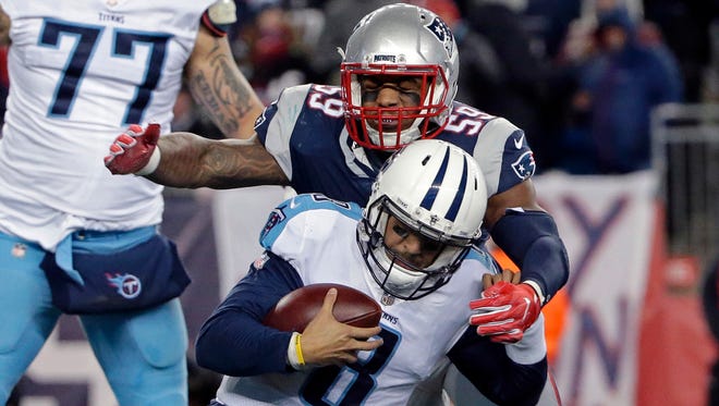 New England Patriots linebacker Marquis Flowers (59) sacks Tennessee Titans quarterback Marcus Mariota (8) during the second half of an NFL divisional playoff football game, Saturday, Jan. 13, 2018, in Foxborough, Mass. (AP Photo/Steven Senne)