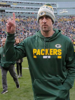 Green Bay Packers quarterback Aaron Rodgers (12) celebrates an overtime win against Tampa Bay Sunday, December 3, 2017, at Lambeau Field in Green Bay, Wis.