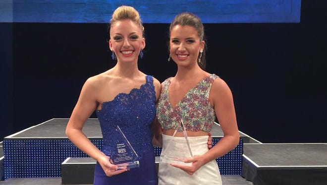 Miss Wisconsin's Outstanding Teen, Kylene Spanbauer, left, of Fond du Lac poses with her preliminary talent award trophy along with Miss North Carolina's Teen, Catherine White who won the evening gown award on Wednesday night in Orlando.