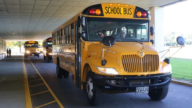 School buses leave Oakwood Middle School in Plain Township. The Plain Local leaders opposed House Bill 117, which would revive the School Area Transfer Act that Plain had successfully fought in federal court.