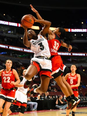 McDonalds High School All-American West player Jackie Young (3) shoots the ball against McDonalds High School All-American East player Crystal Dangerfield (32) during the second half at the United Center.