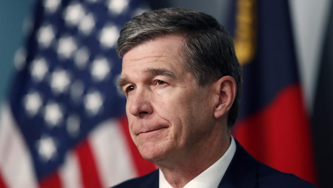 North Carolina Gov. Roy Cooper listens to a question during a briefing on the coronavirus pandemic at the Emergency Operations Center in Raleigh May 26.