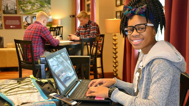Evangel journalism student Dari’Anne Hudson easily uses multiple wireless devices on campus.