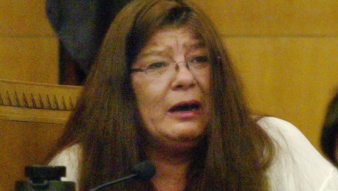 The mother of Jaime Olivas, Lisa Olivas, testifies on the stand in Sheboygan County Circuit Court Branch 2 Wednesday April 13, 2016 in Sheboygan.  Jaime Olivas was hit and killed in 2011 by a city truck with a leaf collection system mounted to the front of it. The family's lawsuit against the city argues the mounted system obstructed the driver’s view of Olivas and that the city should be held responsible for his death.