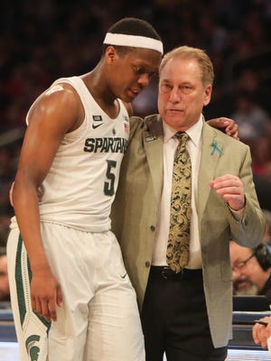 Michigan State head coach Tom Izzo and Cassius Winston talk on the bench during second half action against Wisconsin Friday, March 2, 2018 at Madison Square Garden in New York.