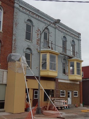 Sandra Johnson bought the Triune Building in 2012. She is one of many Washington property owners who have restored historic downtown structures as part of the community's aggressive downtown revitalization program. The Triune has housed a beauty shop, a Maid-Rite and a buggy factory.