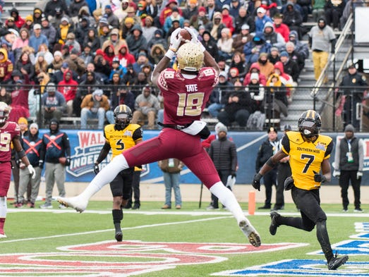 Junior wide reciever Auden Tate (18) catches a touchdown